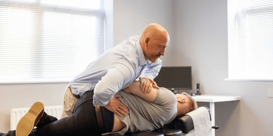 Chiropractor Helping patient