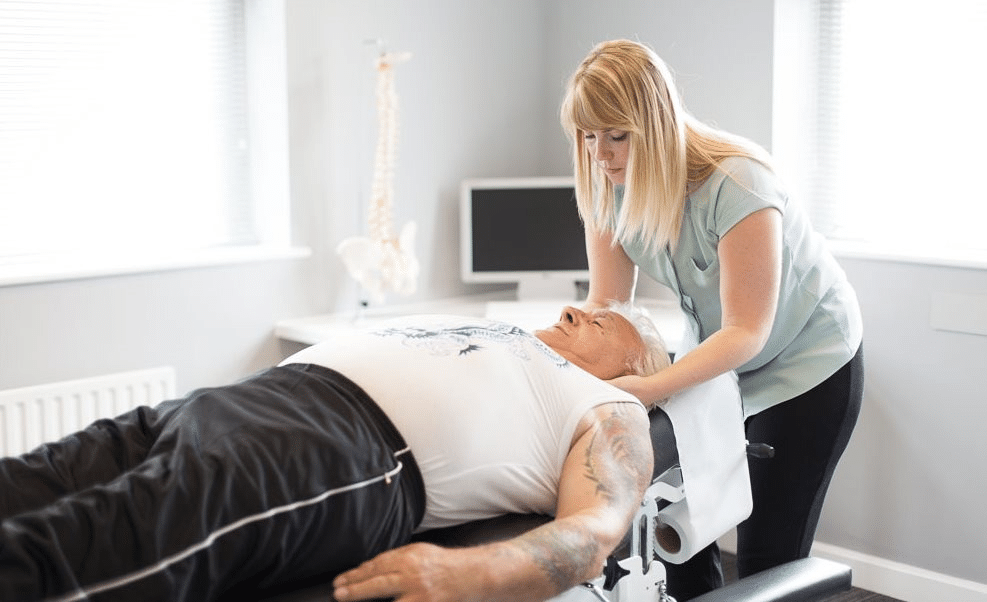 Chiropractor Helping patient with neck pain