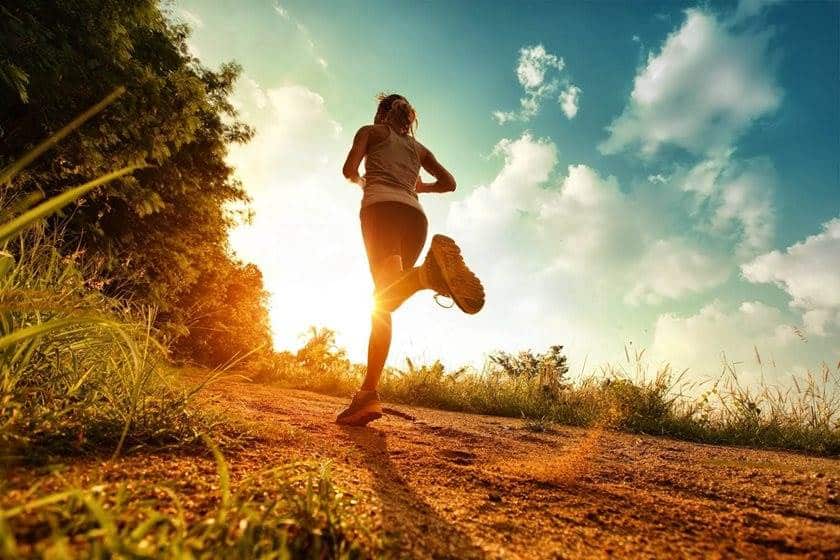 woman running up a hill