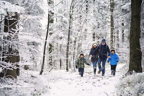 family outside in the snow