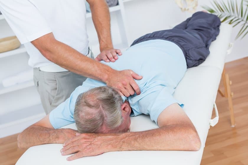 Chiropractor helping out a patient
