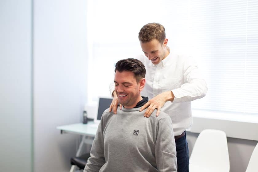 Chiropractor Helping client
