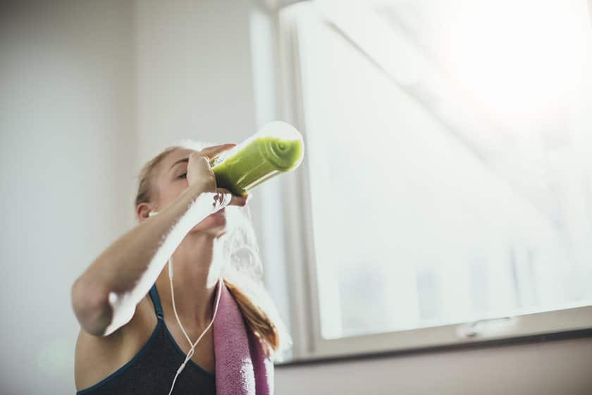 women drinking while exercising
