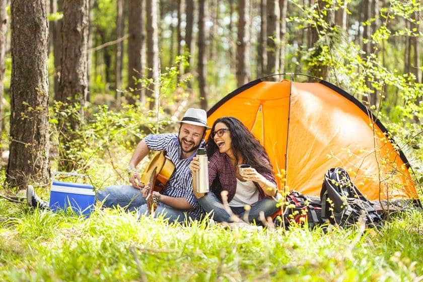 Couple outside Camping with tent