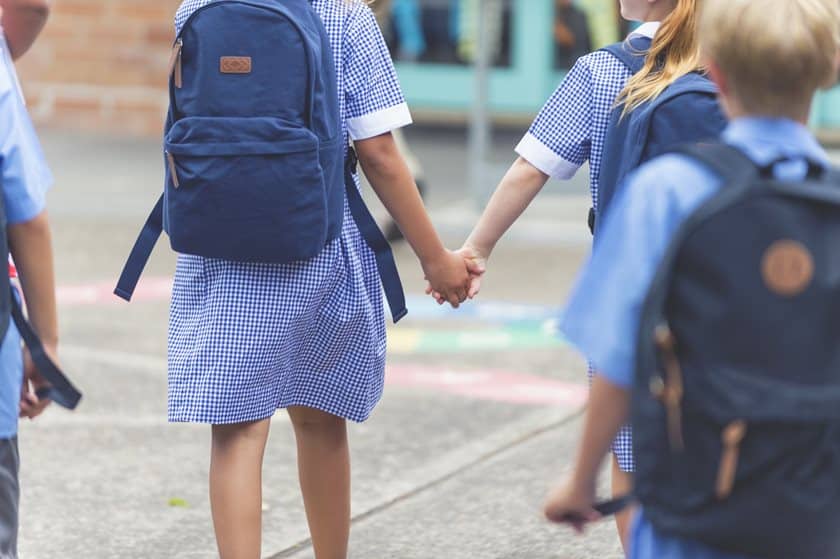 children holding hands at school