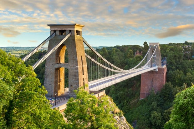 A wide angle view of the Clifton Suspension Bridge spanning the Avon Gorge in the city of Bristol, England, UK.